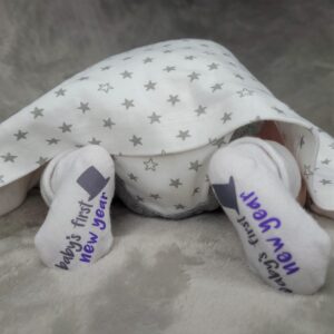 "Baby's First New Years Socks" with black top hat graphic