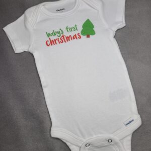 Baby's First Christmas bodysuit with Christmas tree graphic all on grey background